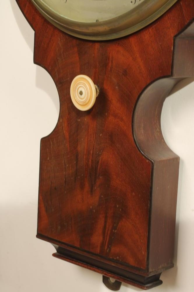 A MAHOGANY WHEEL BAROMETER signed Elliot Bros. Image