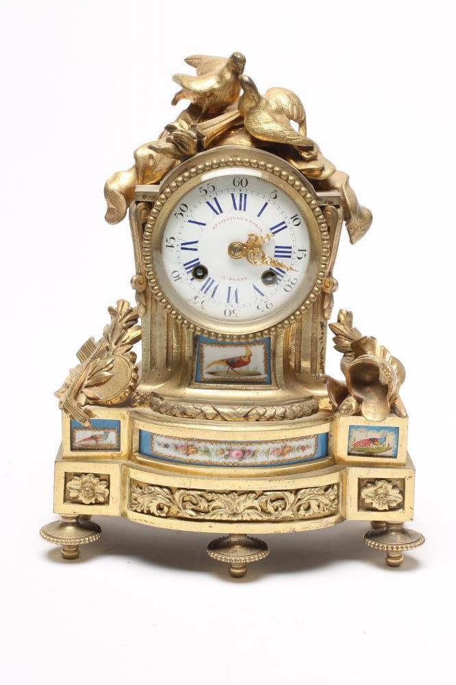 A FRENCH ORMOLU AND PORCELAIN CASED MANTEL CLOCK Image