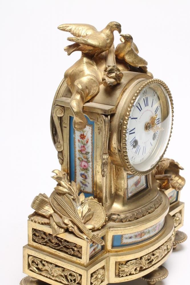 A FRENCH ORMOLU AND PORCELAIN CASED MANTEL CLOCK Image