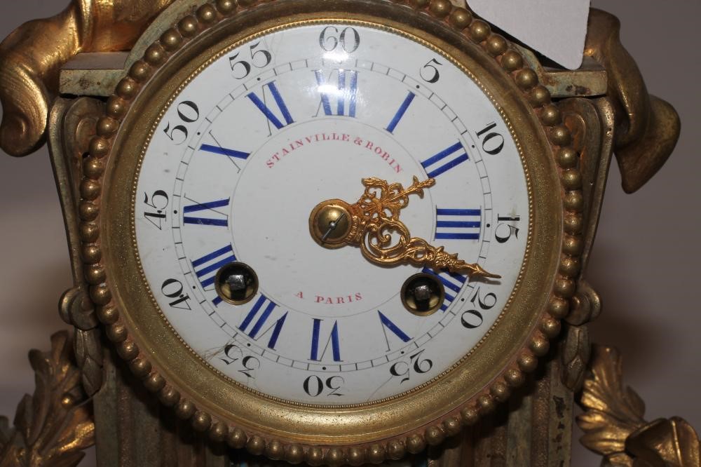A FRENCH ORMOLU AND PORCELAIN CASED MANTEL CLOCK Image