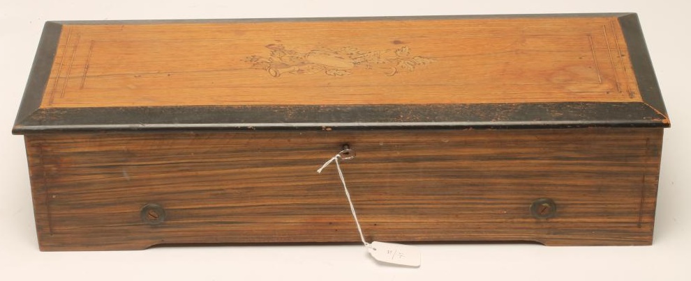 A SWISS MUSICAL BOX playing eight classical airs as listed on the tune sheet Image