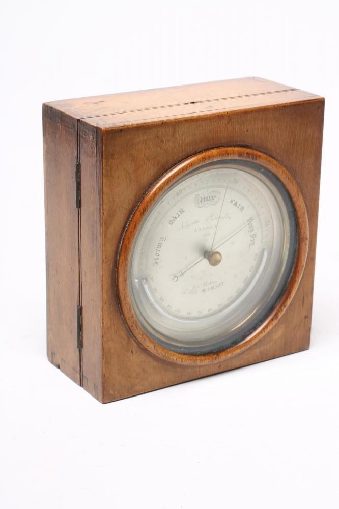 A BRASS CASED ANEROID BAROMETER by Negretti & Zambra Image