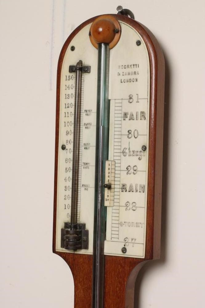 AN OAK CASED STICK BAROMETER by Negretti & Zambra Image