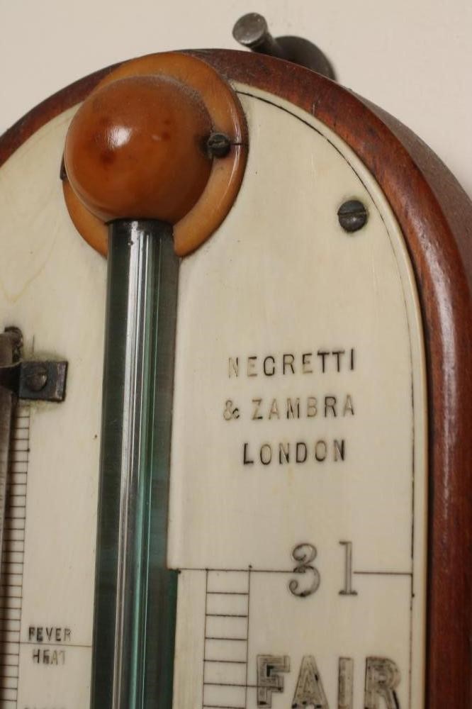 AN OAK CASED STICK BAROMETER by Negretti & Zambra Image