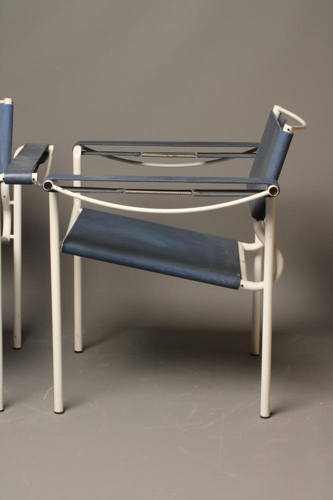 A PAIR OF ITALIAN SLING RETRO SLING CHAIRS in blue rubber and white painted tubular metal Image