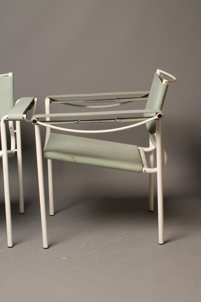 A PAIR OF ITALIAN SLING RETRO SLING CHAIRS in blue rubber and white painted tubular metal Image