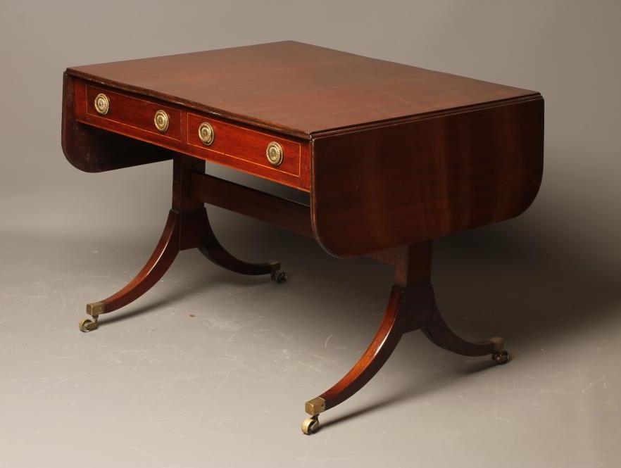 A MAHOGANY SOFA TABLE Image
