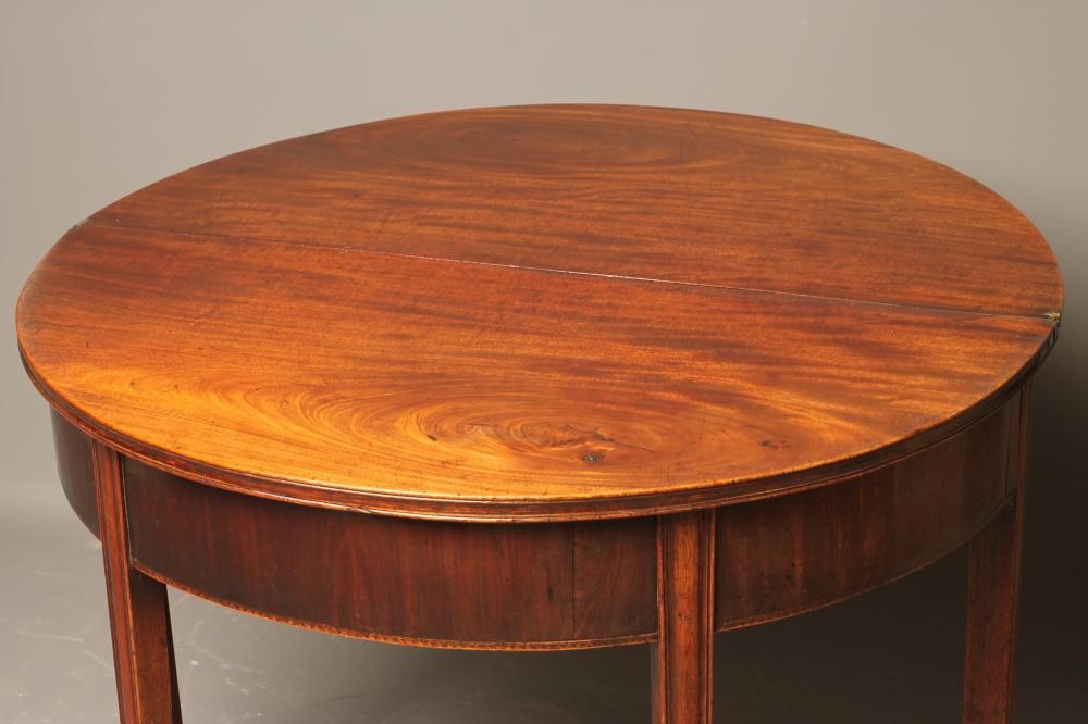 A GEORGIAN MAHOGANY FOLDING TEA TABLE Image