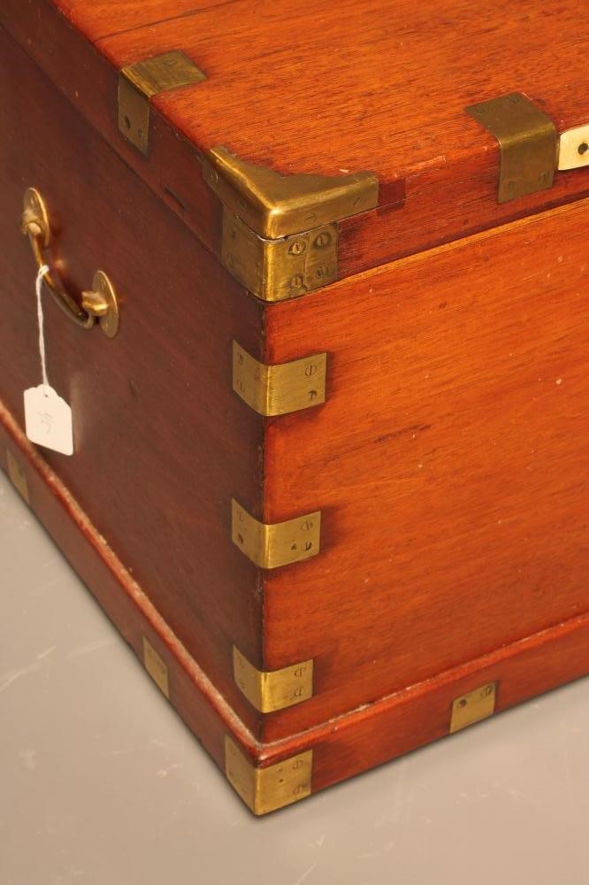 A MAHOGANY AND BRASS BOUND CHEST Image