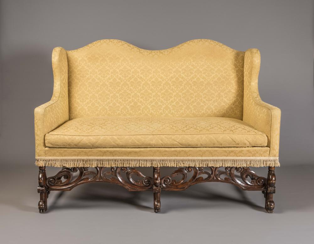 A WILLIAM AND MARY STYLE MAHOGANY CAMEL BACK SOFA Image
