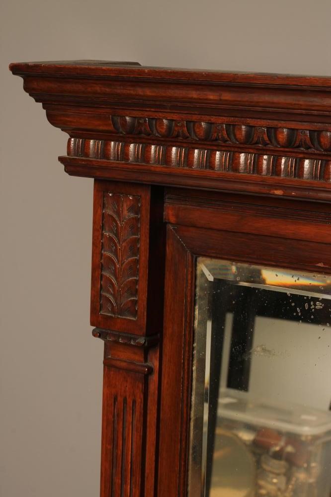 A LATE VICTORIAN OAK FRAMED PIER GLASS with bevelled oblong plate flanked by leaf capped fluted Image