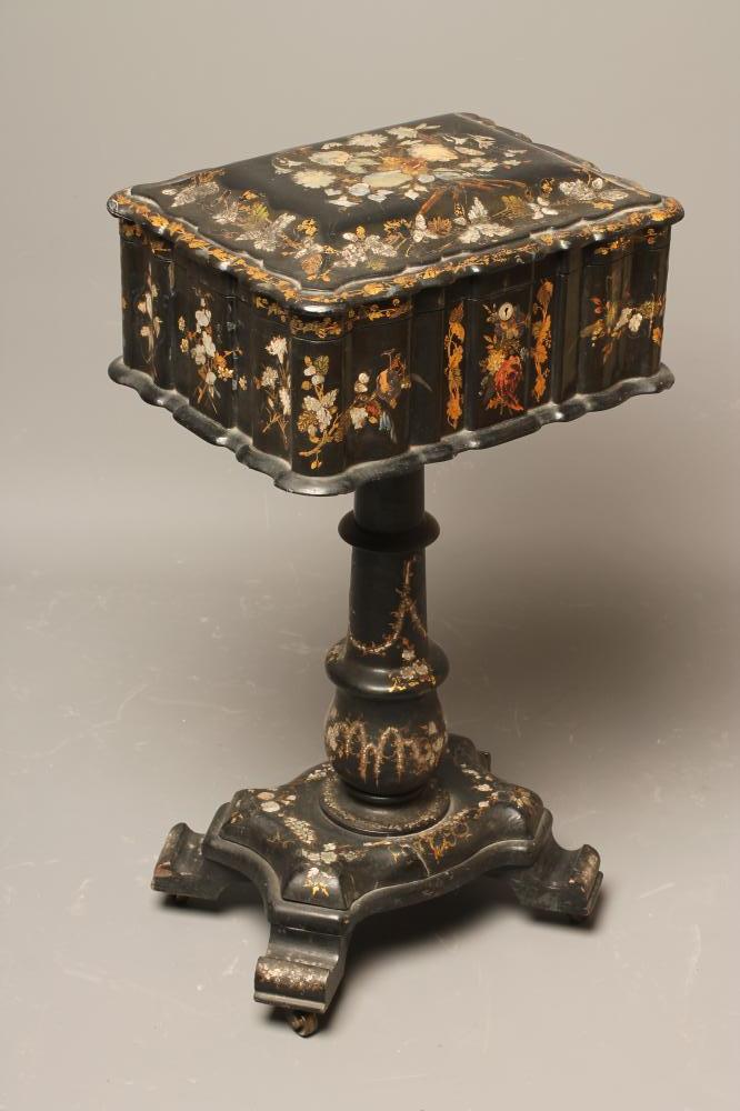 A VICTORIAN PAPIER MACHE TEAPOY of serpentine oblong form gilded with floral sprays and mother of Image