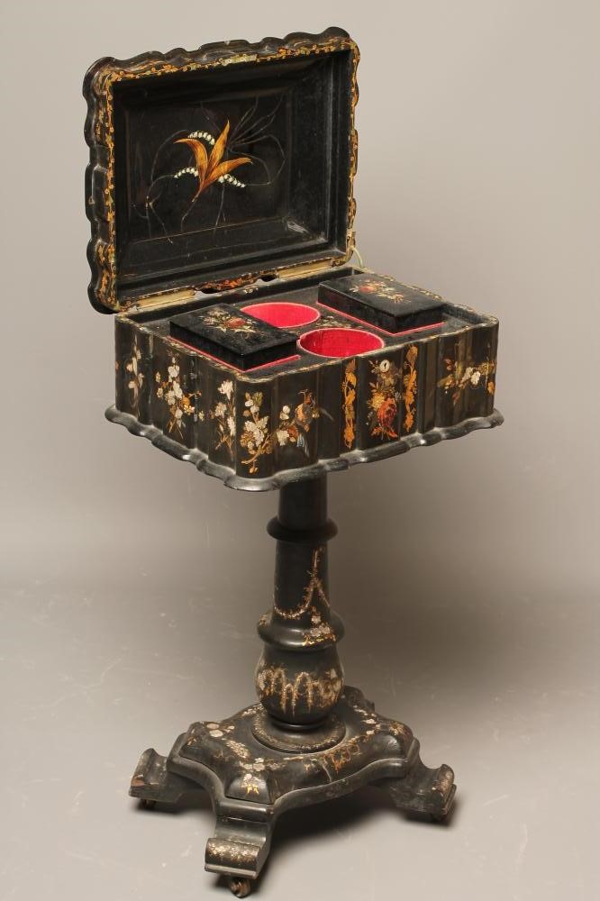 A VICTORIAN PAPIER MACHE TEAPOY of serpentine oblong form gilded with floral sprays and mother of Image