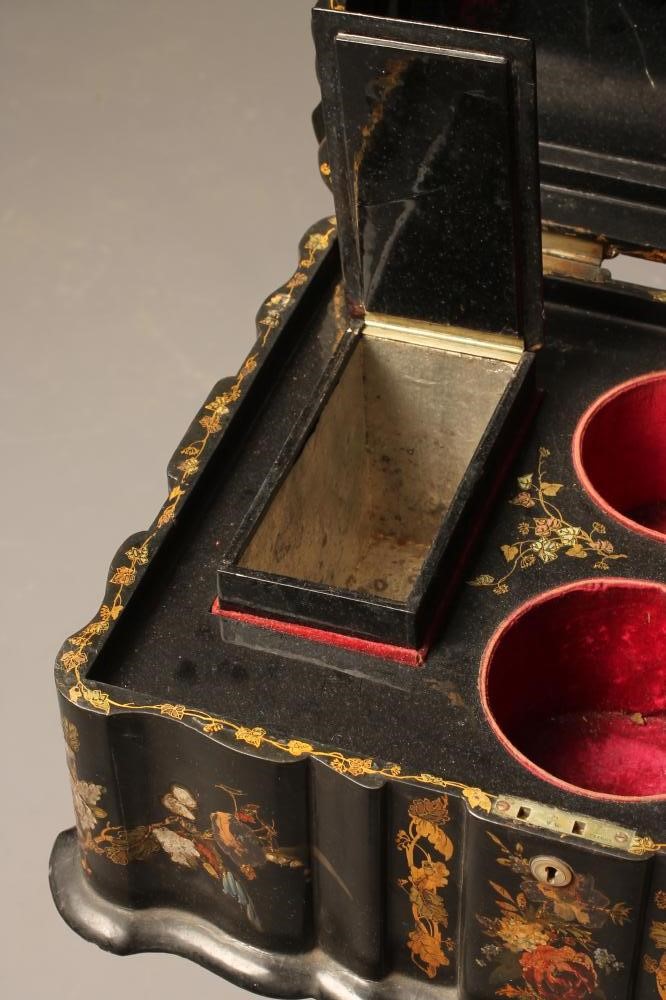 A VICTORIAN PAPIER MACHE TEAPOY of serpentine oblong form gilded with floral sprays and mother of Image