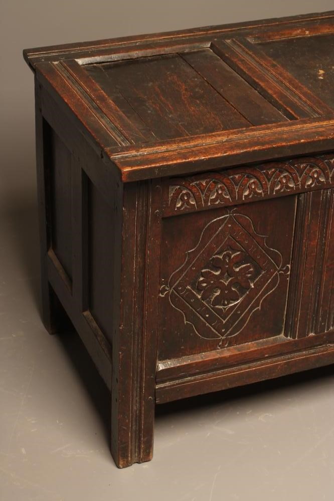 AN OAK PANELLED COFFER Image