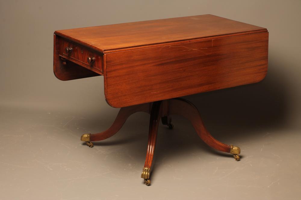 A LATE GEORGIAN MAHOGANY PEMBROKE TABLE of rounded oblong form Image