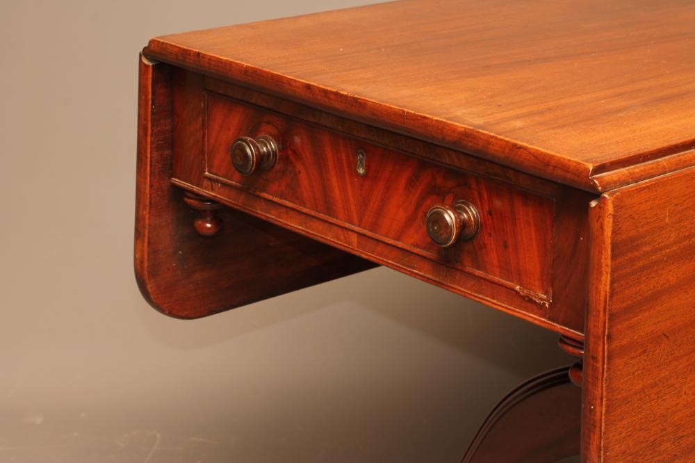 A LATE GEORGIAN MAHOGANY PEMBROKE TABLE of rounded oblong form Image