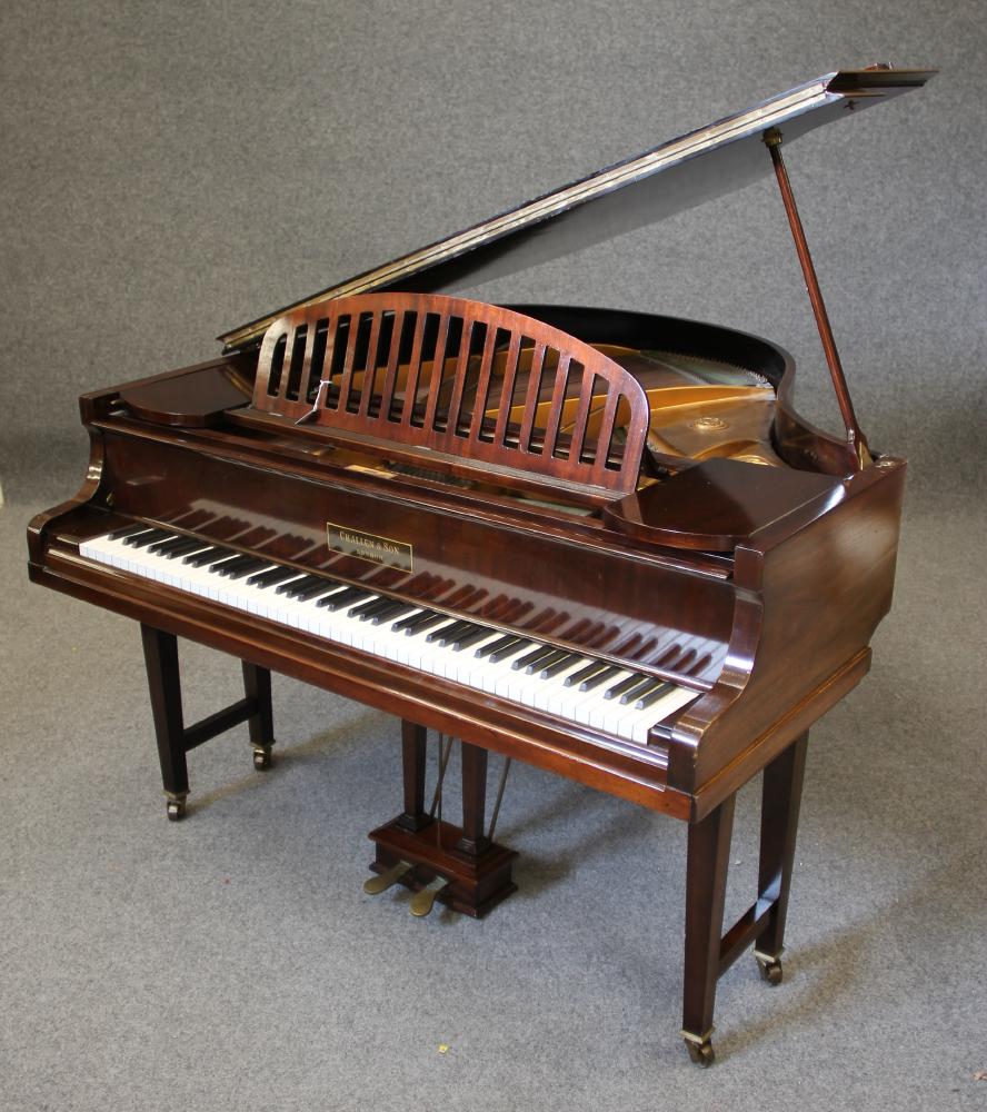 A CHALLEN BABY GRAND PIANO in mahogany case with arched slatted music stand Image