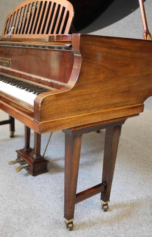 A CHALLEN BABY GRAND PIANO in mahogany case with arched slatted music stand Image