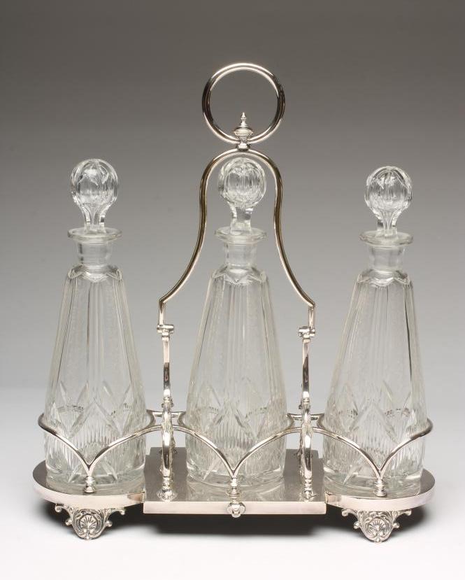 AN EDWARDIAN EPNS TRIPLE DECANTER STAND Image