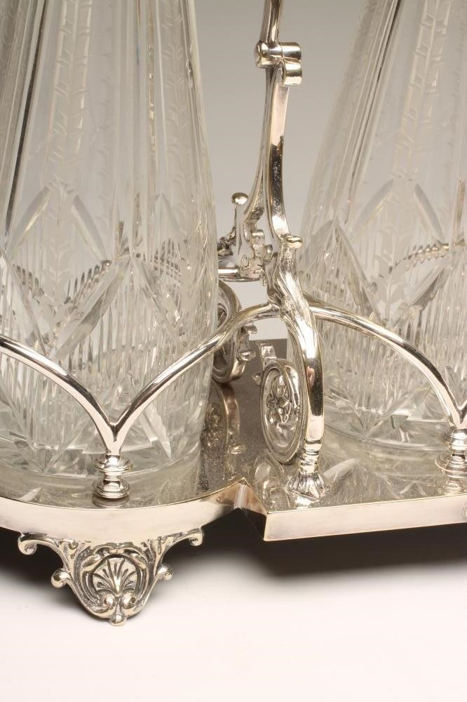 AN EDWARDIAN EPNS TRIPLE DECANTER STAND Image