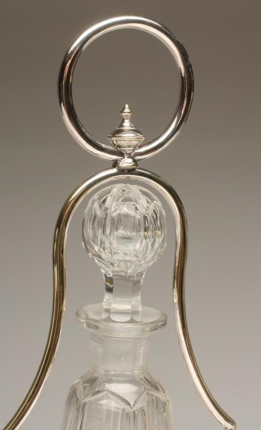 AN EDWARDIAN EPNS TRIPLE DECANTER STAND Image