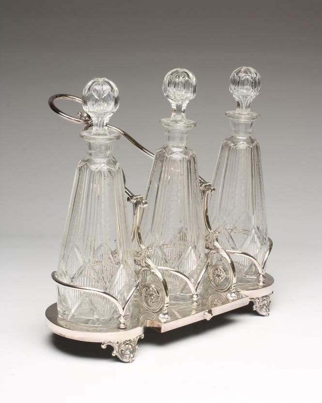 AN EDWARDIAN EPNS TRIPLE DECANTER STAND Image