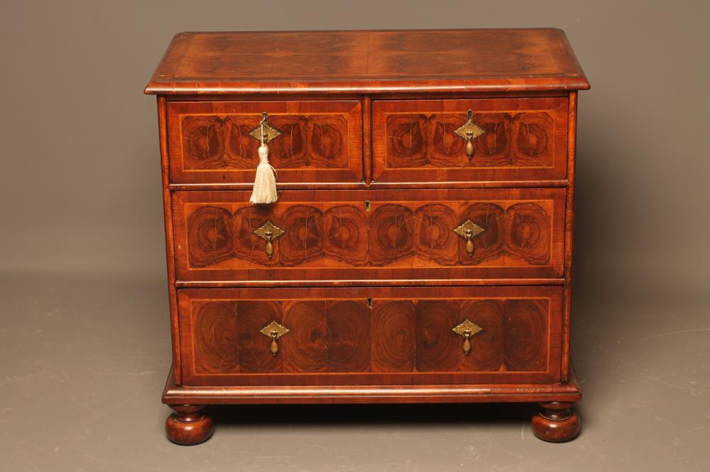A WILLIAM AND MARY STYLE OYSTER VENEERED CHEST Image