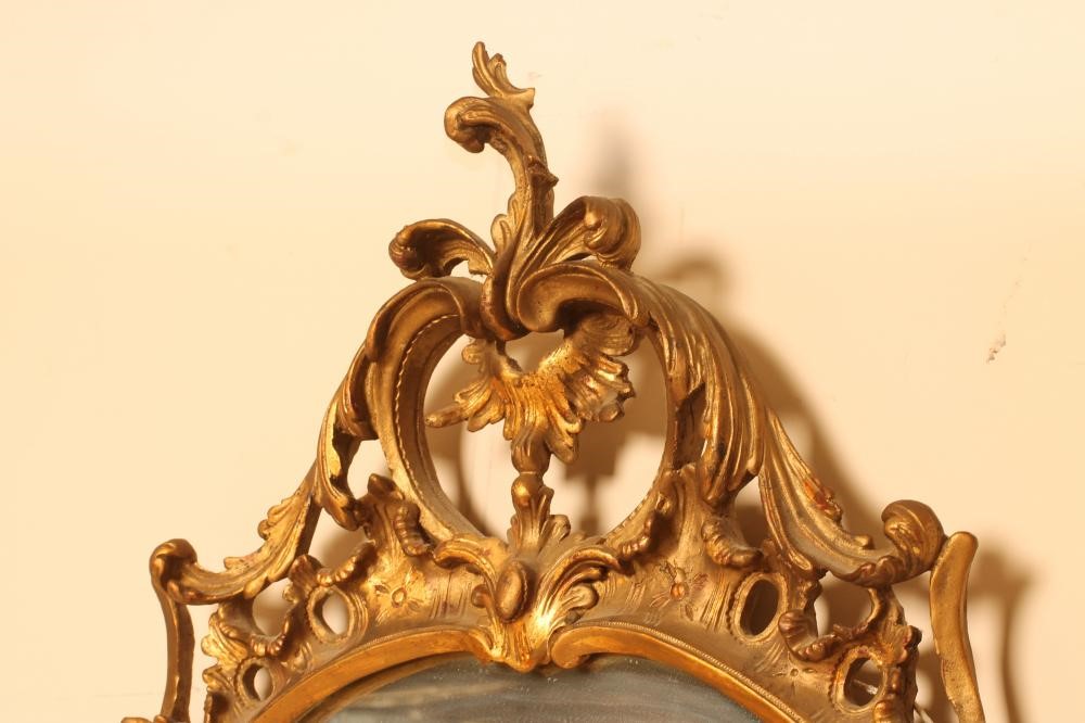 A CARVED AND GILDED ROCOCO PIER GLASS Image