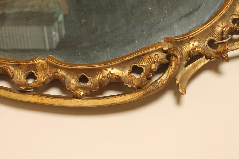 A CARVED AND GILDED ROCOCO PIER GLASS Image
