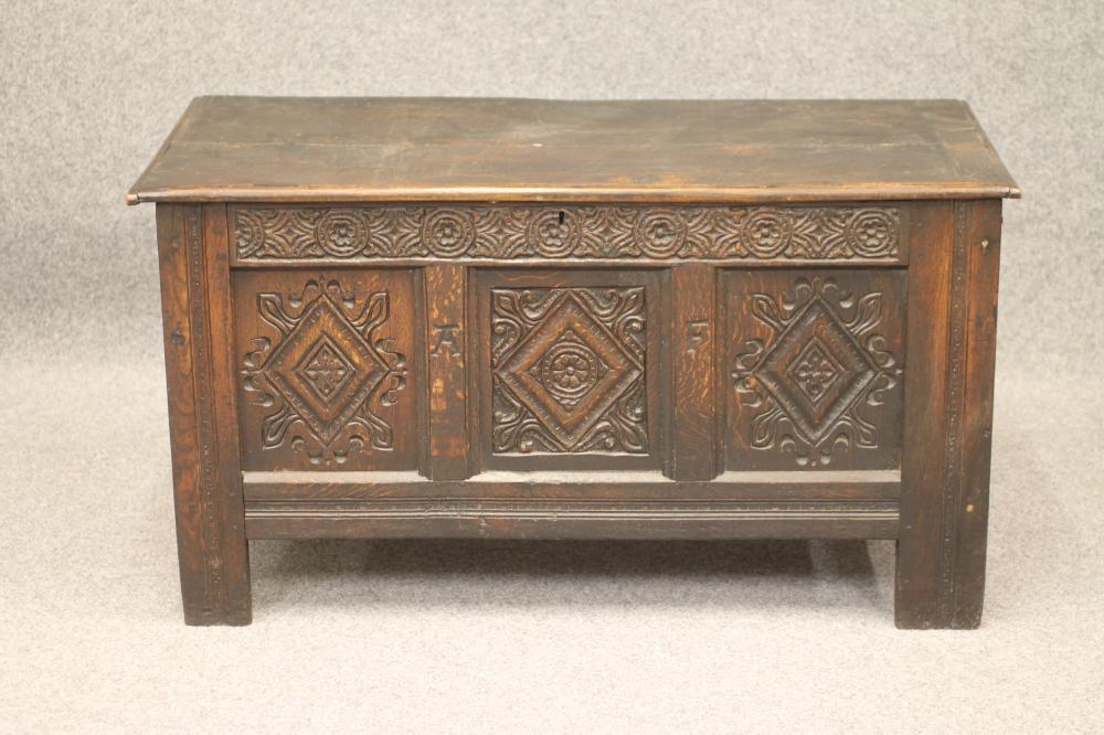 AN OAK PANELLED COFFER Image