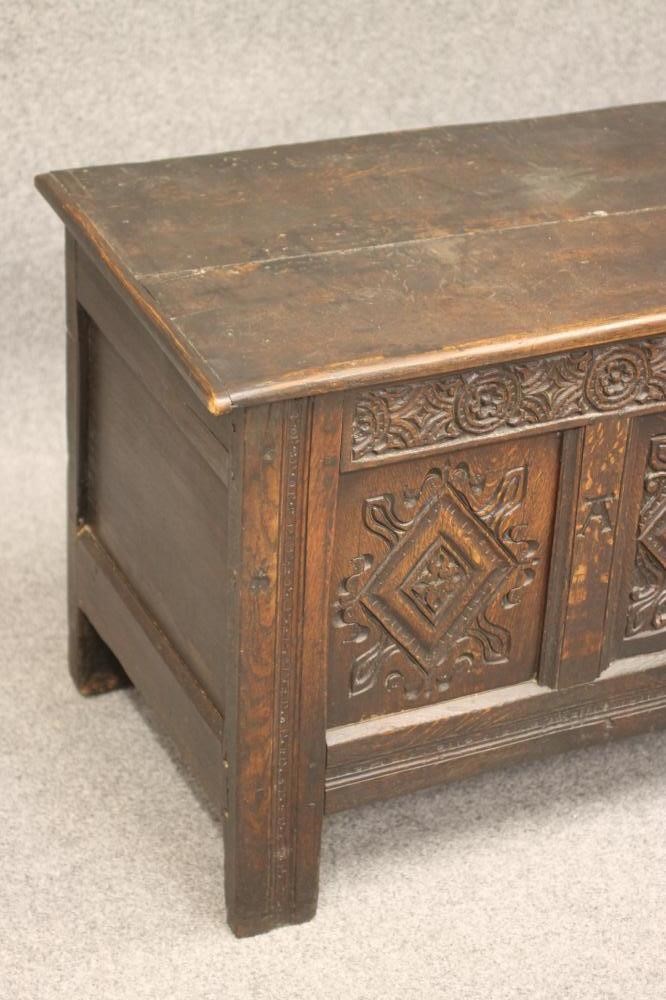 AN OAK PANELLED COFFER Image