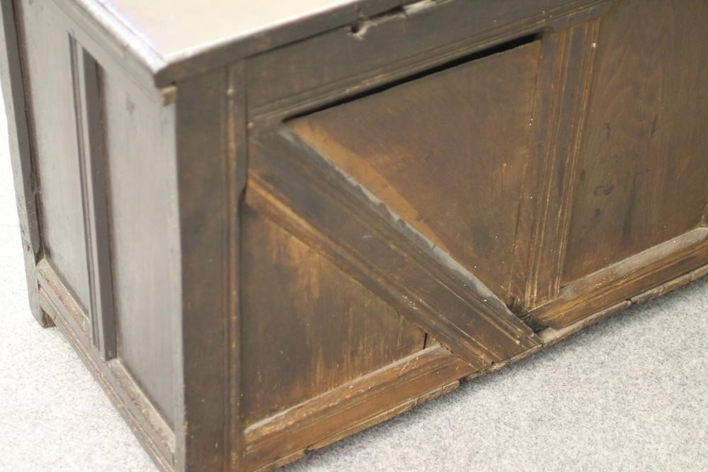 AN OAK PANELLED COFFER Image