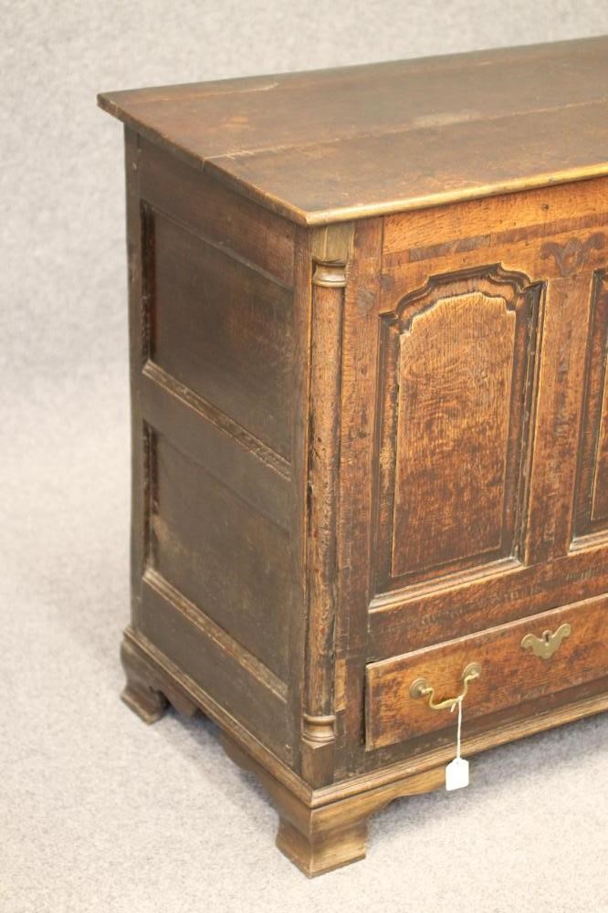 A GEORGIAN OAK AND WALNUT BANDED PANELLED CHEST Image
