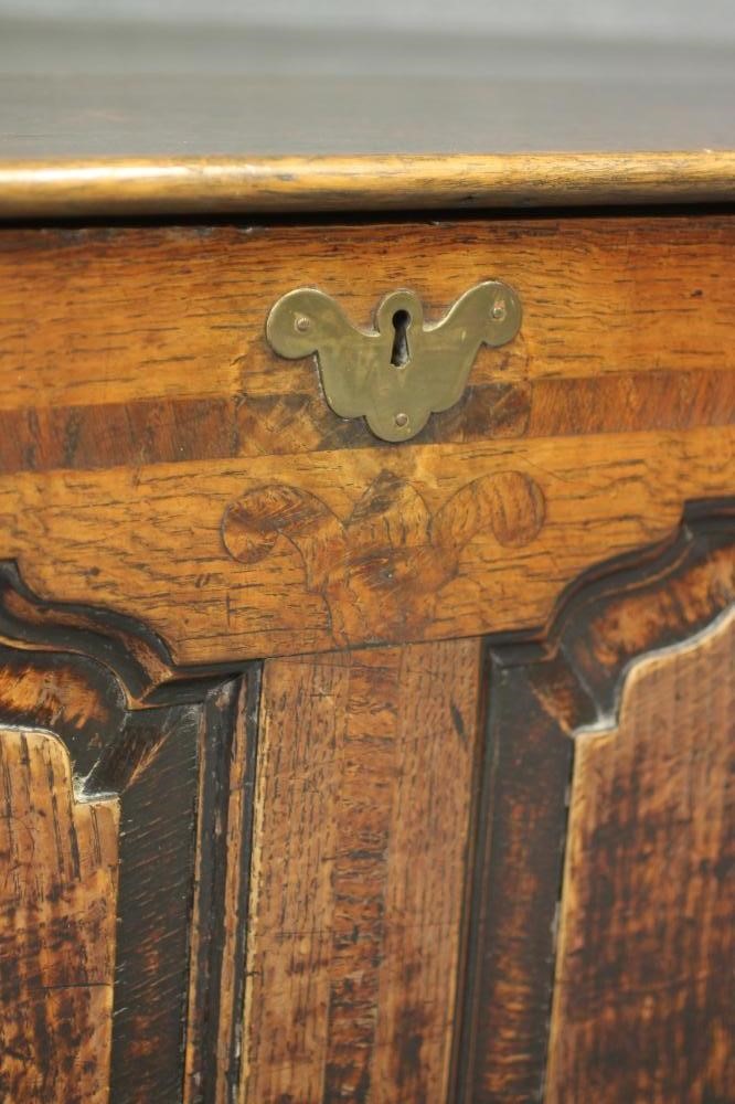 A GEORGIAN OAK AND WALNUT BANDED PANELLED CHEST Image