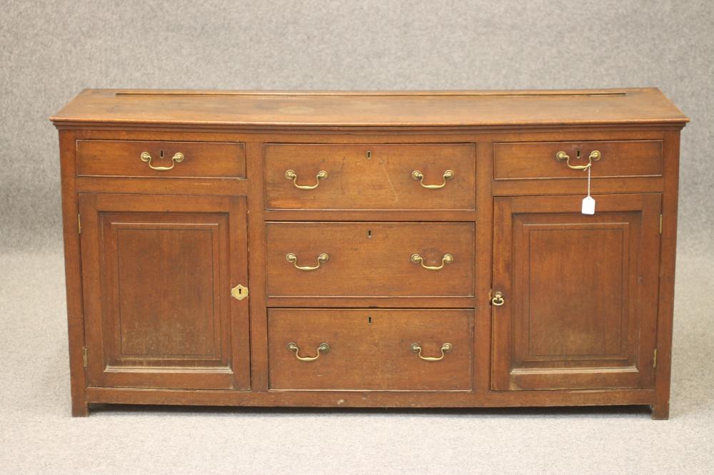 AN OAK ENCLOSED DRESSER Image