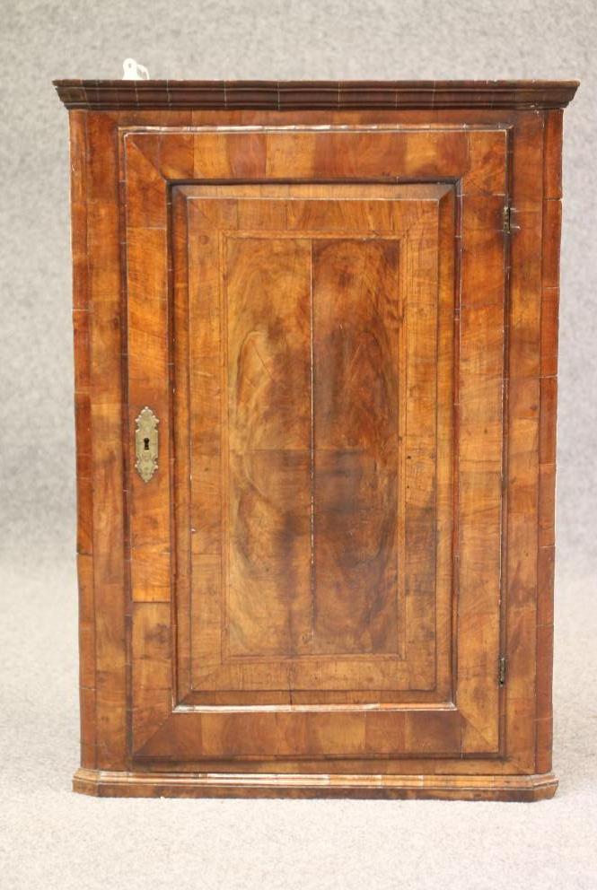A GEORGIAN WALNUT CORNER CUPBOARD Image