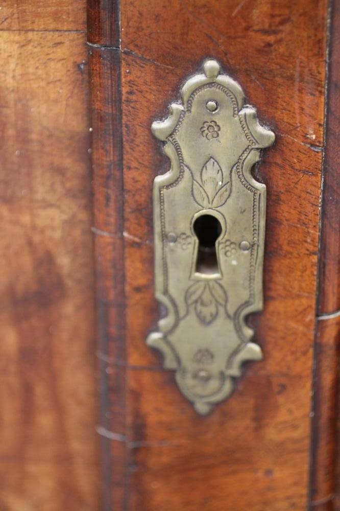 A GEORGIAN WALNUT CORNER CUPBOARD Image