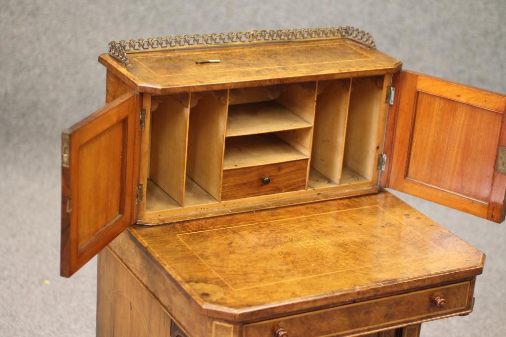 AN EARLY VICTORIAN BURR WALNUT DAVENPORT Image