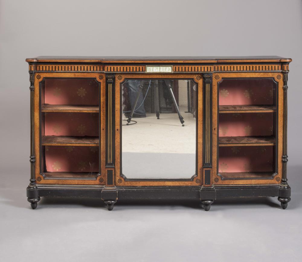 A VICTORIAN AMBOYNA AND EBONISED CREDENZA of shallow breakfront form Image