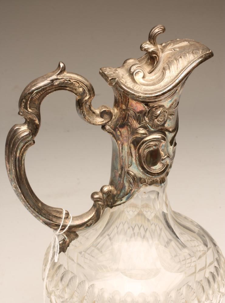 AN EPNS MOUNTED CLEAR GLASS CLARET JUG Image