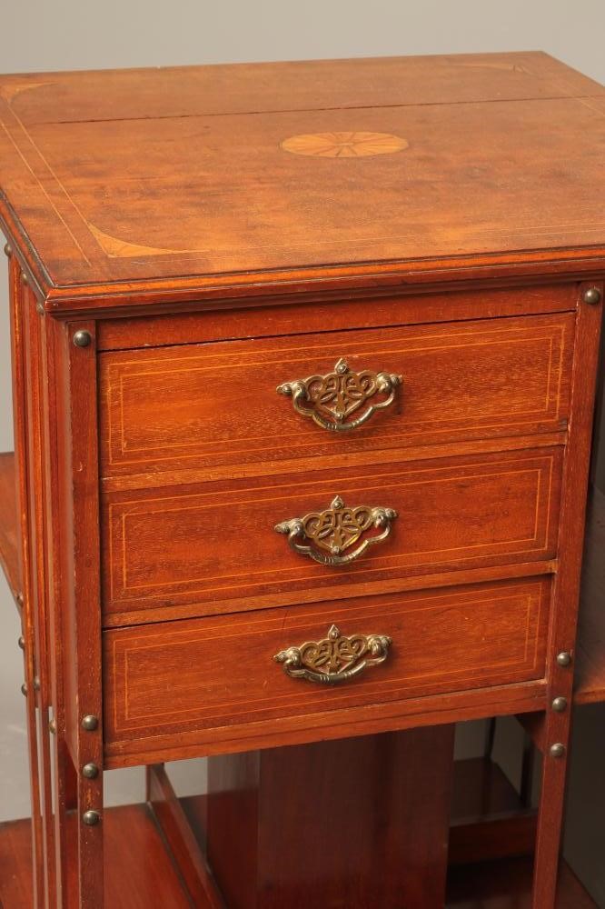 AN EDWARDIAN MAHOGANY REVOLVING BOOKCASE of square form with stringing Image
