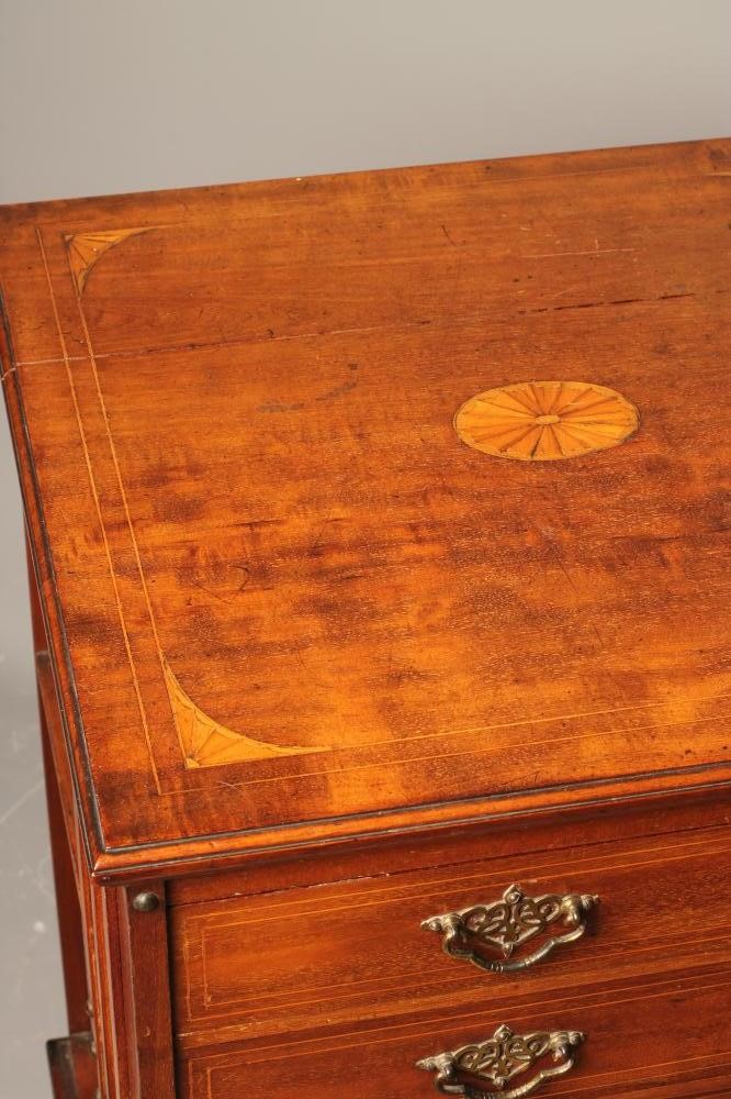 AN EDWARDIAN MAHOGANY REVOLVING BOOKCASE of square form with stringing Image