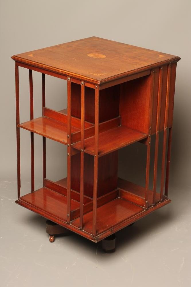 AN EDWARDIAN MAHOGANY REVOLVING BOOKCASE of square form with stringing Image
