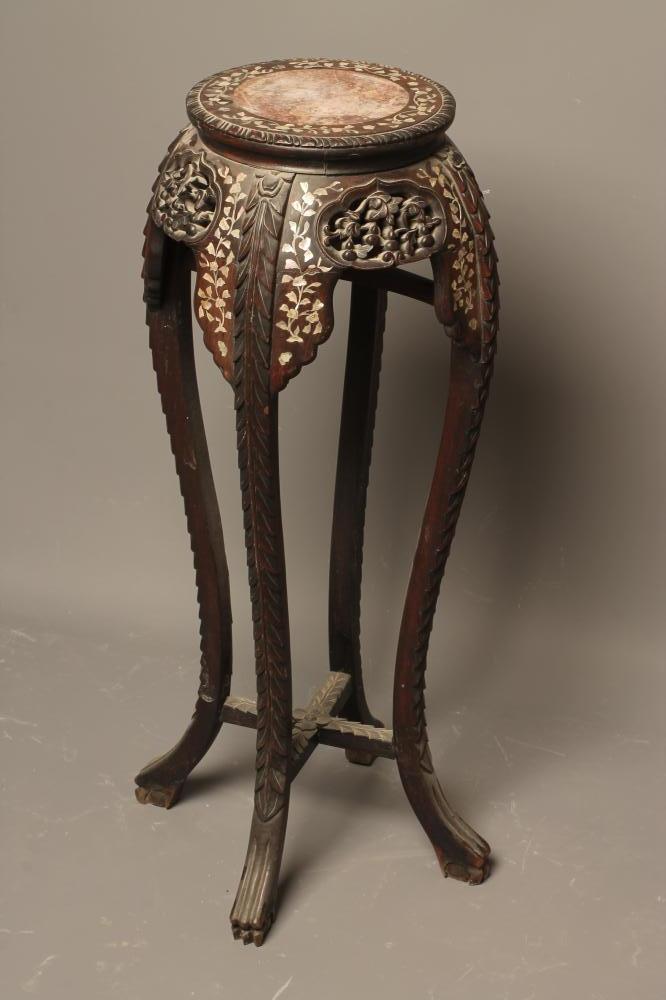 A CHINESE CARVED HARDWOOD JARDINIERE STAND of circular form inlaid with trailing foliage in mother Image