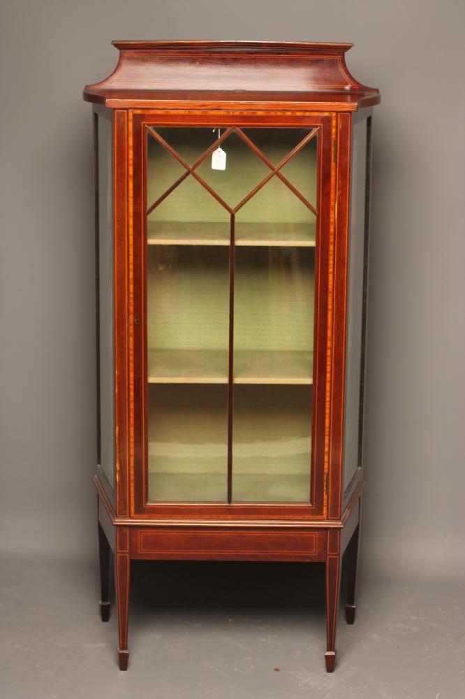 AN EDWARDIAN MAHOGANY PIER DISPLAY CABINET of canted oblong form with satinwood banding and Image