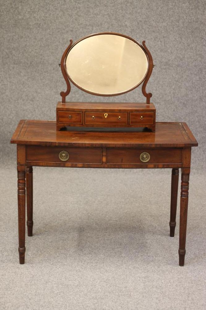A LATE GEORGIAN DRESSING TABLE Image