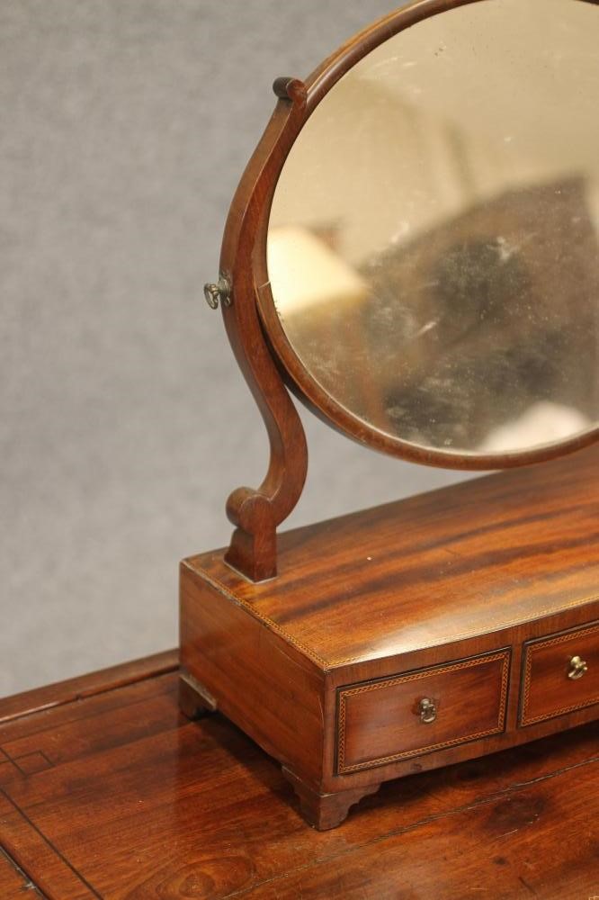 A LATE GEORGIAN DRESSING TABLE Image