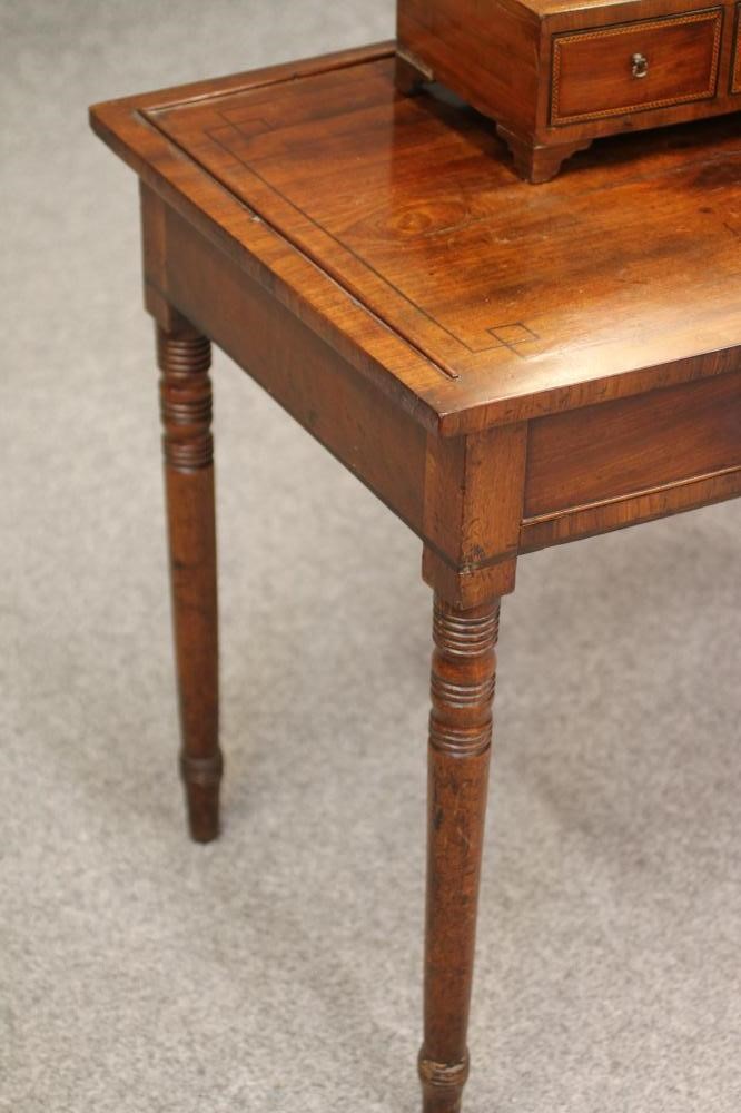 A LATE GEORGIAN DRESSING TABLE Image