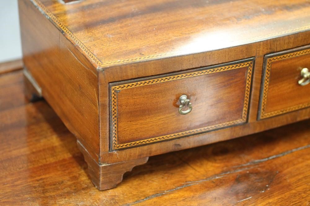 A LATE GEORGIAN DRESSING TABLE Image